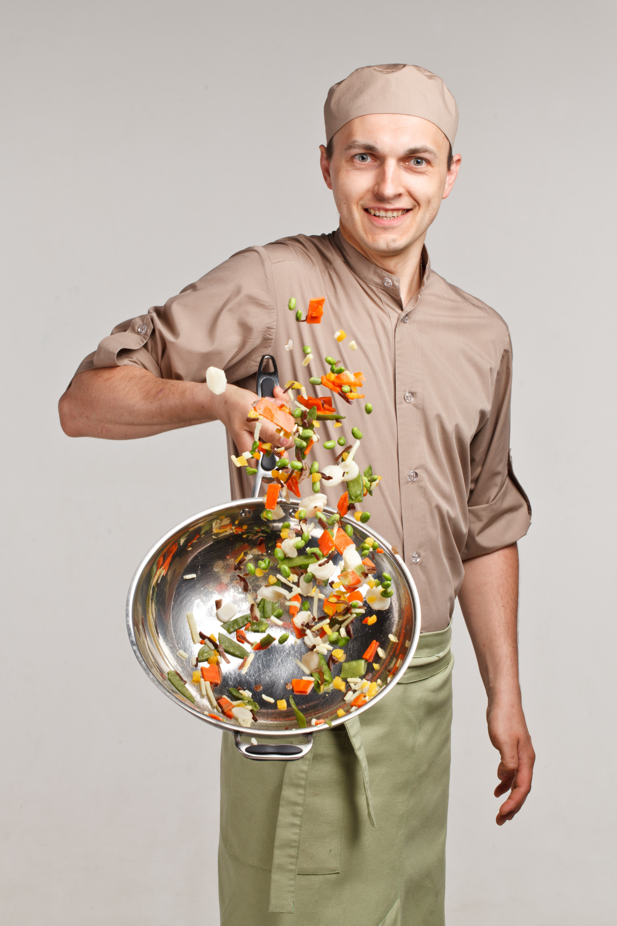Founder arranging plates in a bright studio